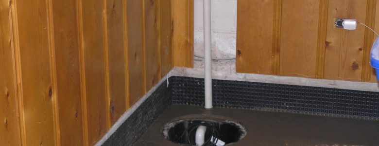 Sump pump pit installation in a basement floor to prevent water accumulation and flooding